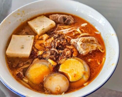 Delicious spicy ramen with tofu, eggs, beef, and noodles in a flavorful broth. Perfect for comfort food lovers and Asian cuisine enthusiasts.